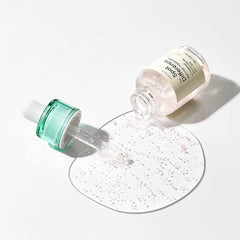 Applying AXIS-Y Spot The Difference Blemish Treatment to acne-prone skin